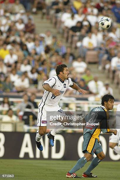 Tony Dayak of the San Jose Earthquakes wins a header against the Los Angeles Galaxy during the first half at the Rose Bowl on July 4, 2002 in...