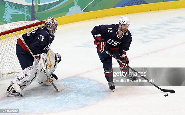 Ryan Malone of the United States in action in front of Goalkeeper Ryan Miller of the United States during the ice hockey men's semifinal game between...