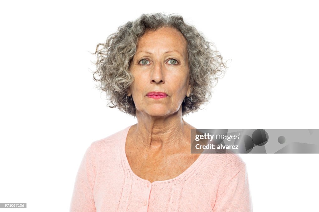 Senior woman in casuals looking serious