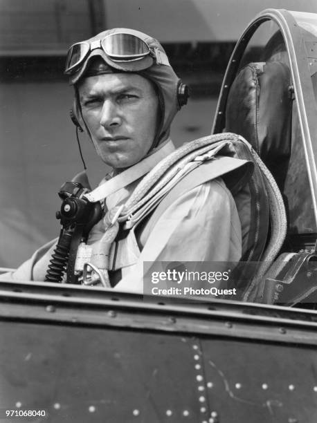 Portrait of US Navy Lieutenant Commander James H Flatley Jr in the cockpit of his Grumman F6F Hellcat on board the USS Yorktown , October 1943.