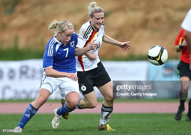 Anja Mittag of Germany and Annika Kukkonen of Finland battle for the ball during the Woman's Algarve Cup match between Germany and Finland at the...