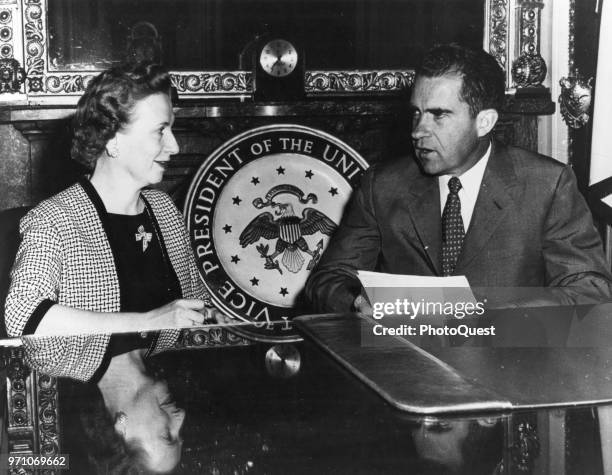 View of secretary Rose Mary Woods and her boss, US Vice President Richard Nixon , in the latter's office, Washington DC, 1960. The seal of the Vice...