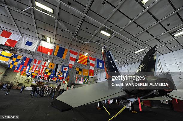 Journalists visit the USS Carl Vinson Nimitz class aircraft supercarrier, at anchor in Guanabara Bay, Rio de Janeiro, Brazil, on February 26, 2010....