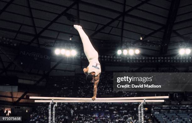 Toth Balazs of Hungary performs on the parallel bars during the gymnastics competition of the 1990 Goodwill Games held from July 20 The gymnastics...