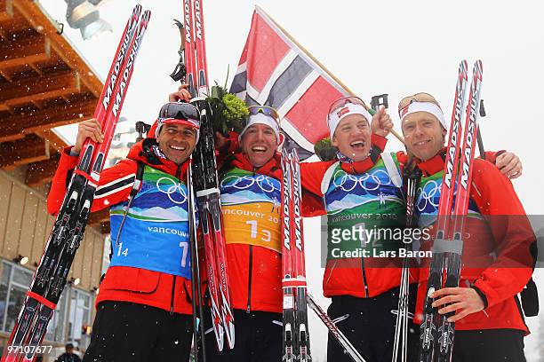 Ole Einar Bjoerndalen, Emil Hegle Svendsen,Tarjei Boe and Halvard Hanevold of Norway celebrate winning the gold medal during the men's 4 x 7.5 km...