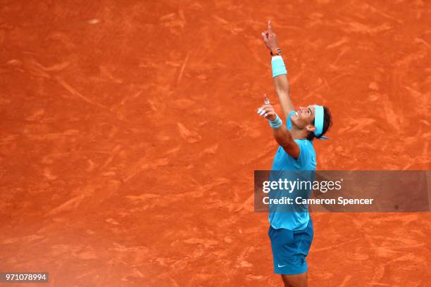 Rafael Nadal of Spain celebrates victory following the mens singles final against Dominic Thiem of Austria during day fifteen of the 2018 French Open...