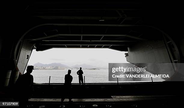 Marines look at rhe city from the USS Carl Vinson Nimitz class aircraft supercarrier, at anchor in Guanabara Bay, Rio de Janeiro, Brazil, on February...