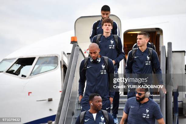 France's national football team goalkeeper Steve Mandanda, defender Adil Rami, midfielder Corentin Tolisso, defender Benjamin Pavard, defender Lucas...