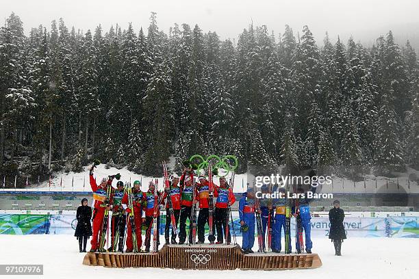 Dominik Landertinger, Daniel Mesotitsch, Simon Eder and Christoph Sumann of Austria celebrate winning the silver medal, Halvard Hanevold, Tarjei Boe,...