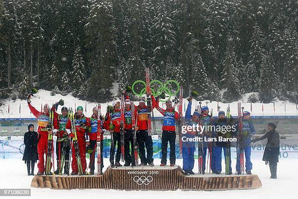 Dominik Landertinger, Daniel Mesotitsch, Simon Eder and Christoph Sumann of Austria celebrate winning the silver medal, Halvard Hanevold, Tarjei Boe,...