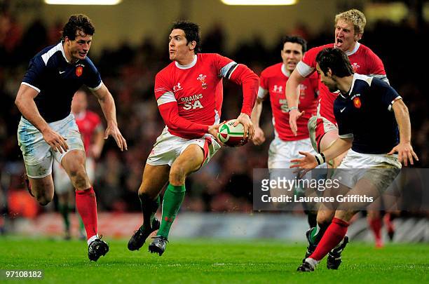 James Hook of Wales surges forward during the RBS Six Nations Championship match between Wales and France at the Millennium Stadium on February 26,...