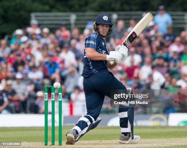 Scotland's George Munsey on his way to 55 during the first innings of the One Day International at the Grange Cricket Club on June 10, 2018 in...