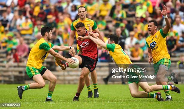 Monaghan , Ireland - 10 June 2018; David McKibbin of Down in action against Ryan McHugh and Mark McHugh of Donegal during the Ulster GAA Football...