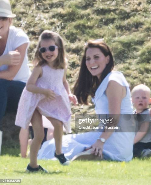 Catherine, Duchess of Cambridge and Princess Charlotte of Cambridge attend the Maserati Royal Charity Polo Trophy at Beaufort Park on June 10, 2018...