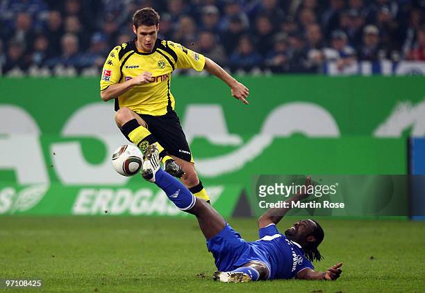 Gerald Asamoah of Schalke and Sebastian Kehl of Dortmund battle for the ball during the Bundesliga match between FC Schalke 04 and Borussia Dortmund...