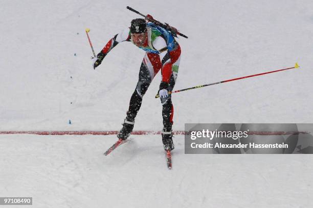 Christoph Sumann of Austria crosses the finish line to win the silver medal during the men's 4 x 7.5 km biathlon relay on day 15 of the 2010...