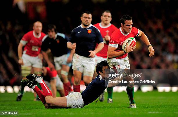 Morgan Parra of France tackles Lee Byrne of Wales during the RBS Six Nations Championship match between Wales and France at the Millennium Stadium on...