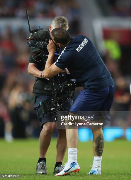 Paddy McGuinness of England jokes with a cameraman prior to the Soccer Aid for UNICEF 2018 match between England and the Rest of the World at Old...