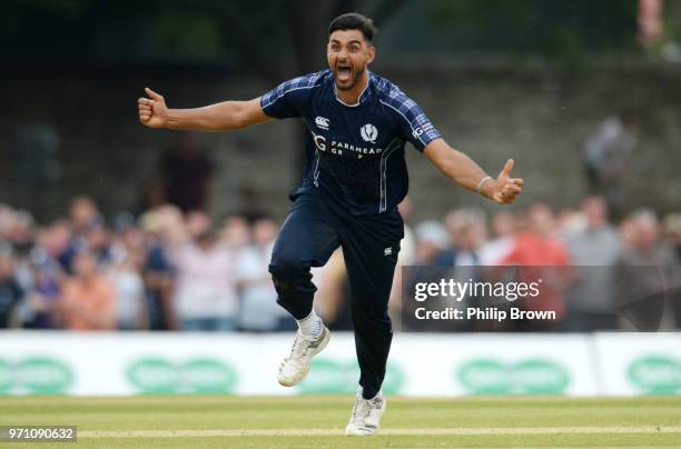 Safyaan Sharif celebrates after taking the final wicket of Mark Wood as Scotland win the One-Day International match between Scotland and England at...