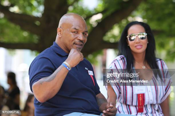 Boxer Mike Tyson is seen during the parade of champions at the International Boxing Hall of Fame for the Weekend of Champions induction event on June...