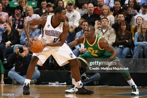 Tyreke Evans of the Sacramento Kings looks to move the ball against Ronnie Brewer of the Utah Jazz during the game at EnergySolutions Arena on...