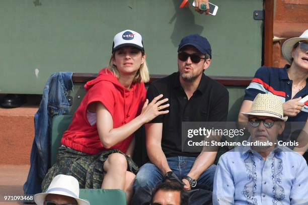 Marion Cotillard and Guillaume Canet attend the Men Final of the 2018 French Open - Day Fifteen at Roland Garros on June 10, 2018 in Paris, France.