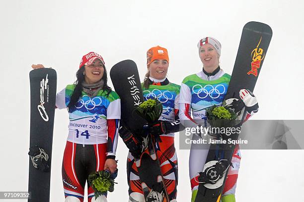 Ekaterina Ilyukhina of Russia celebrates winning silver, Nicolien Sauerbreij of Netherlands gold and Marion Kreiner of Austria bronze during the...