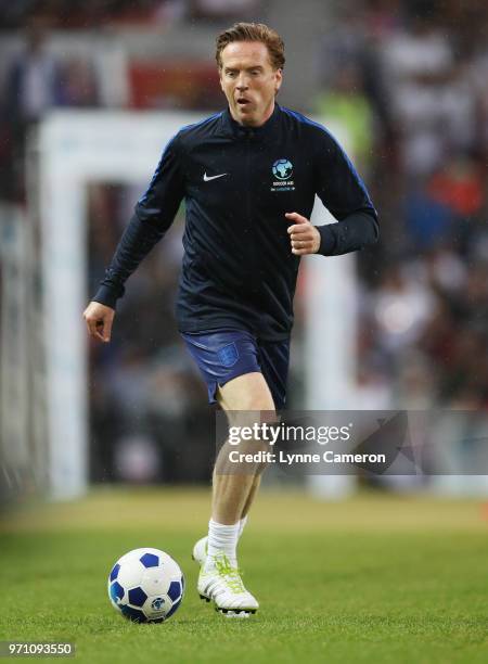 Damian Lewis of England warms up prior to the Soccer Aid for UNICEF 2018 match between England and the Rest of the World at Old Trafford on June 10,...