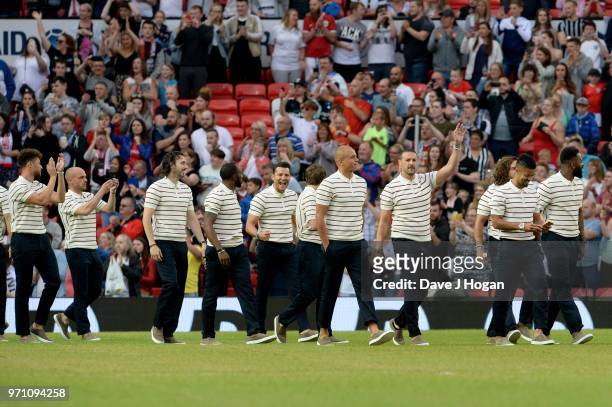 Wes Brown speaks with Paddy McGuinness as the England team walk onto the pitch prior to kick off during Soccer Aid for Unicef 2018 at Old Trafford on...