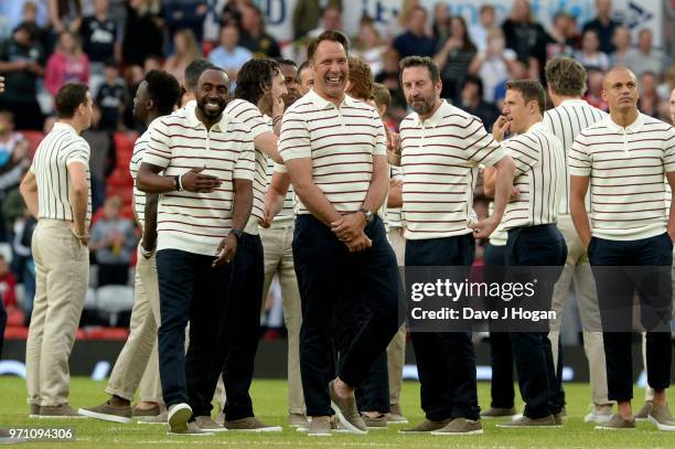 David Harewood shares a laugh with David Seaman prior to kick off during Soccer Aid for Unicef 2018 at Old Trafford on June 10, 2018 in Manchester,...