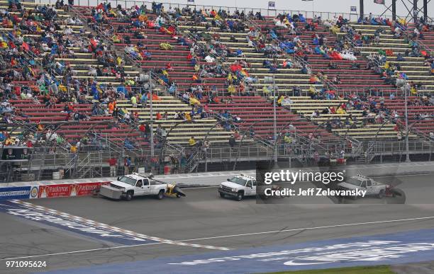 Jet dryers attempt to dry the track during a weather delay for the Monster Energy NASCAR Cup Series FireKeepers Casino 400 at Michigan International...