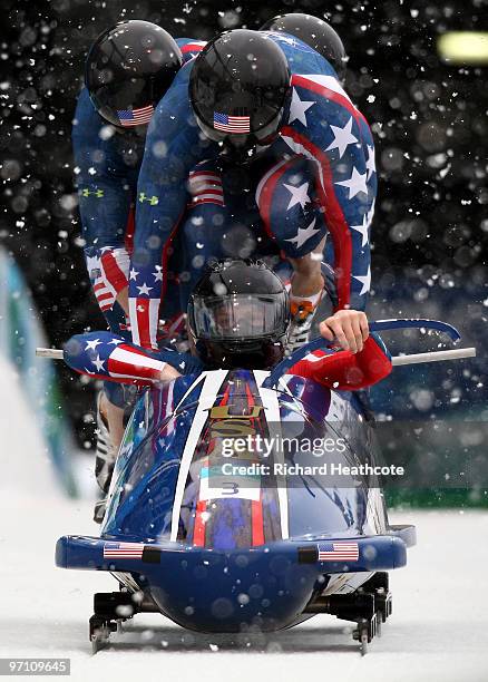 Pilot John Napier, Charles Berkeley, Steven Langton and Christopher Fogt of the United States compete in USA 2 during the four-man bobsleigh heat 1...