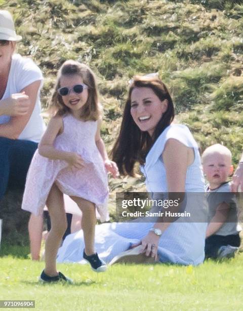 Catherine, Duchess of Cambridge and Princess Charlotte of Cambridge attend the Maserati Royal Charity Polo Trophy at Beaufort Park on June 10, 2018...