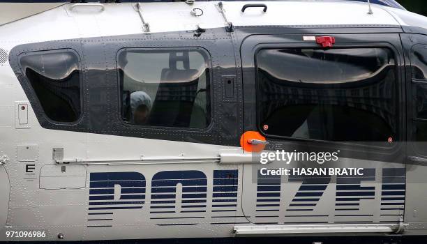 Iraqi asylum seeker Ali Bashar, who is suspected of having killed a German teenage girl, sits inside a helicopter in Wiesbaden, western Germany, on...