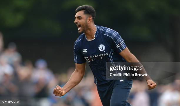 Safyaan Sharif celebrates after taking the final wicket of Mark Wood as Scotland won the One-Day International match between Scotland and England at...