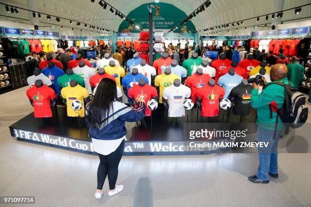 Visitors look at jerseys at the official shop of the FIFA Fan Fest in Moscow, on June 10 ahead of the Russia 2018 World Cup.
