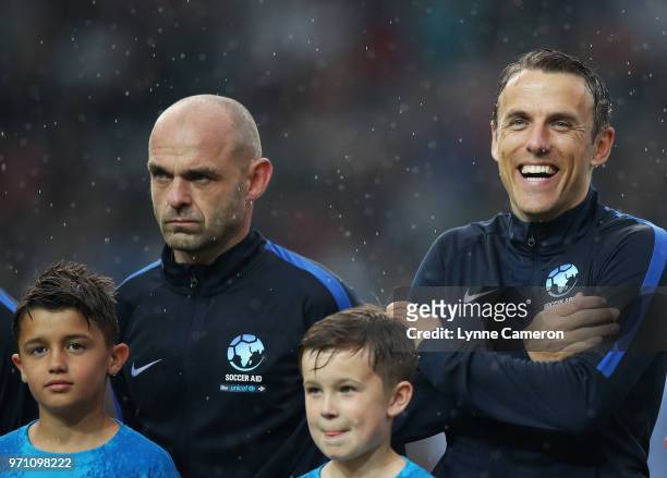 Danny Murphy of England and Phil Neville of England look on prior to the Soccer Aid for UNICEF 2018 match between England and the Rest of the World...
