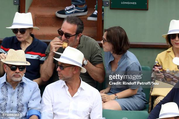 Actor Jean Dujardin and his wife Ice kater Nathalie Pechalat attend the 2018 French Open - Day Fifteen at Roland Garros on June 10, 2018 in Paris,...