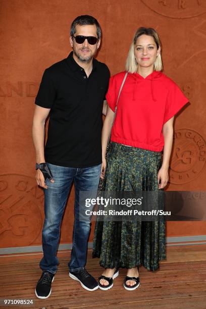 Actors Marion Cotillard and husband Guillaume Canet attend the 2018 French Open - Day Fifteen at Roland Garros on June 10, 2018 in Paris, France.