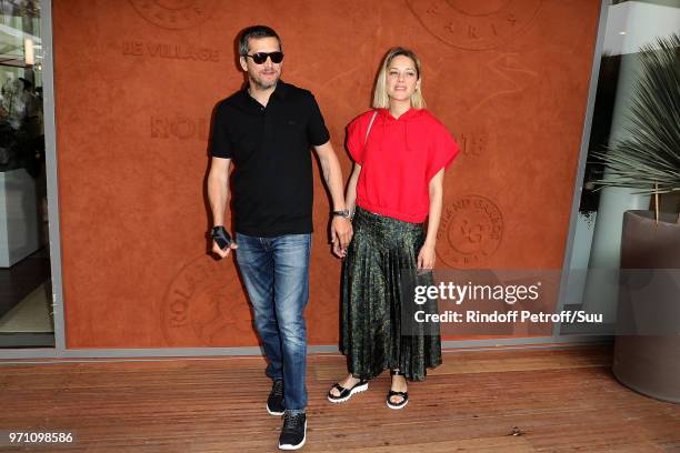 Actors Marion Cotillard and husband Guillaume Canet attend the 2018 French Open - Day Fifteen at Roland Garros on June 10, 2018 in Paris, France.