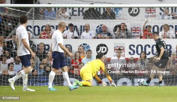 World XI's Robbie Keane scores his side's first goal of the game during the UNICEF Soccer Aid match at Old Trafford, Manchester.