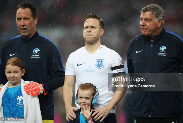 David Seaman of England, Olly Murs of England and Sam Allardyce manager of England look on prior to the Soccer Aid for UNICEF 2018 match between...