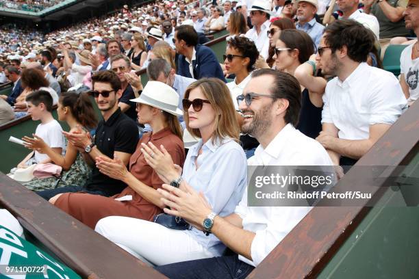 Pierre Niney, Natasha Andrews and Cyril Lignac attend, in the Lacoste loge, the Men Final of the 2018 French Open - Day Fithteen at Roland Garros on...