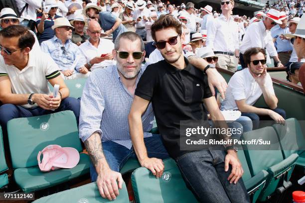 Actors Jalil Lespert and Pierre Niney attend the Men Final of the 2018 French Open - Day Fithteen at Roland Garros on June 10, 2018 in Paris, France.