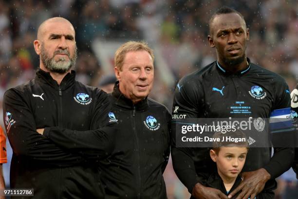 Eric Cantona, Harry Redknapp and Usain Bolt line-up prior to kick off during Soccer Aid for Unicef 2018 at Old Trafford on June 10, 2018 in...