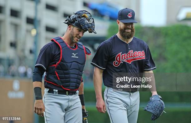 Catcher Yan Gomes of the and Corey Kluber of the Cleveland Indians walks to the dugout at the end of the eight inning of the game against the Detroit...