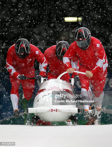 Lyndon Rush, Chris Le Bihan, David Bissett and Lascelles Brown of Canada compete in Canada 1 during the four-man bobsleigh heat 1 on day 15 of the...