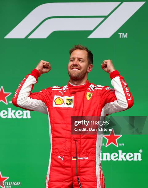 Race winner Sebastian Vettel of Germany and Ferrari celebrates on the podium during the Canadian Formula One Grand Prix at Circuit Gilles Villeneuve...