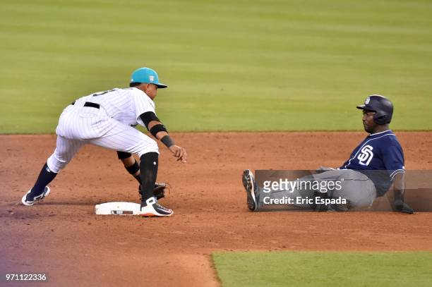 Starlin Castro of the Miami Marlins tags out Jose Pirela of the San Diego Padres at second base during the sixth inning of the game at Marlins Park...