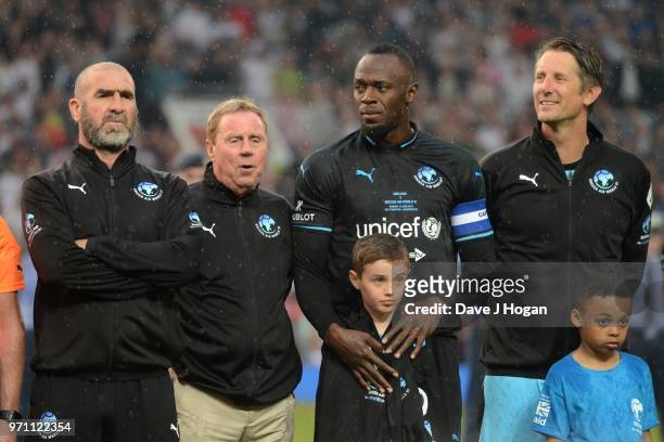 Eric Cantona, Harry Redknapp, Usain Bolt and Edwin Van Der Sar line-up prior to kick off during Soccer Aid for Unicef 2018 at Old Trafford on June...